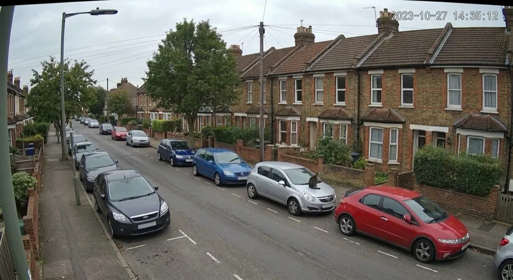 Car vandalism: Motion alert cleared locally. Motion triggered; local AI clears it — a cat on a car bonnet.