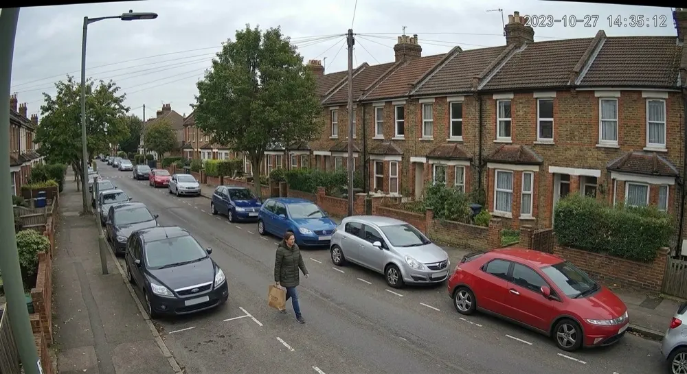 Car vandalism: Camera alert cleared by generative AI. Person escalated for analysis; Gen AI clears it — a pedestrian passing the cars.