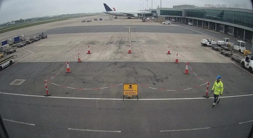 Exclusion zone (apron): Camera alert cleared by generative AI. Person escalated for analysis; Gen AI clears it — ground crew remaining outside the exclusion zone.