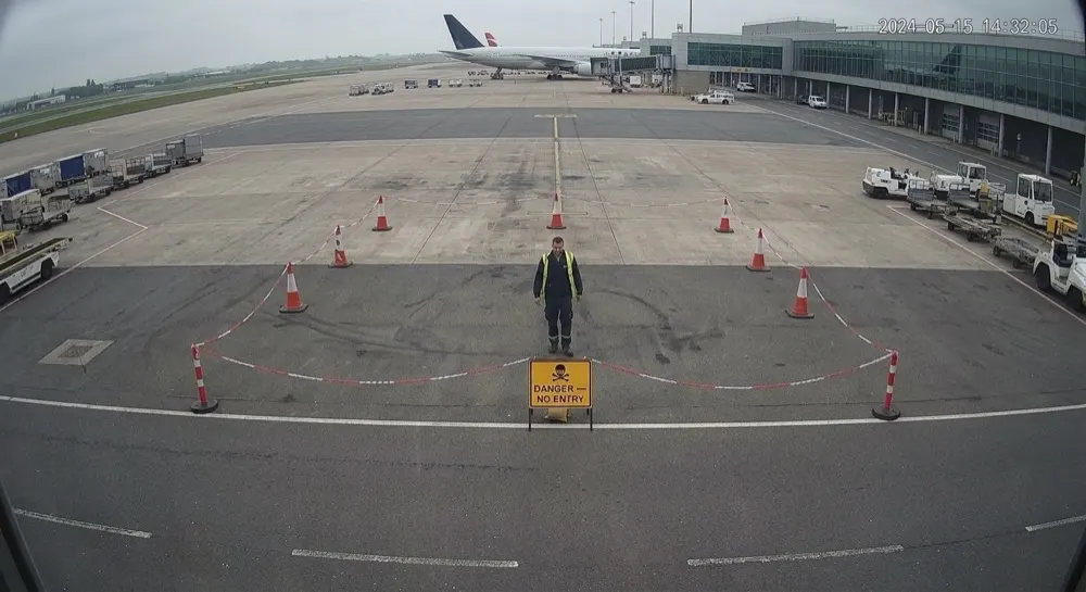 Exclusion zone (apron): Generative AI raises alert. Gen AI confirms a breach — a person has entered the marked apron exclusion zone.