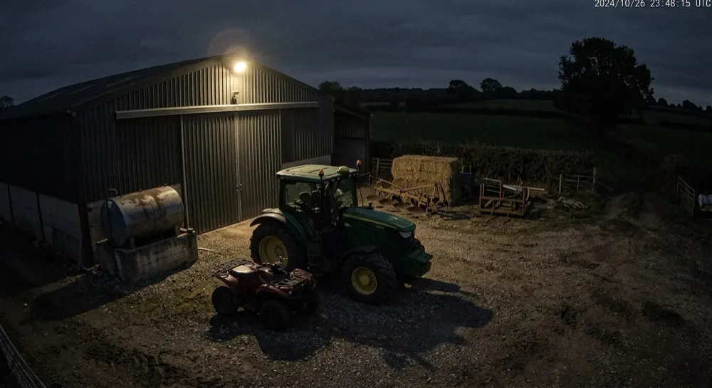 Farm machinery theft: No motion. No alert — yard quiet, machinery parked.