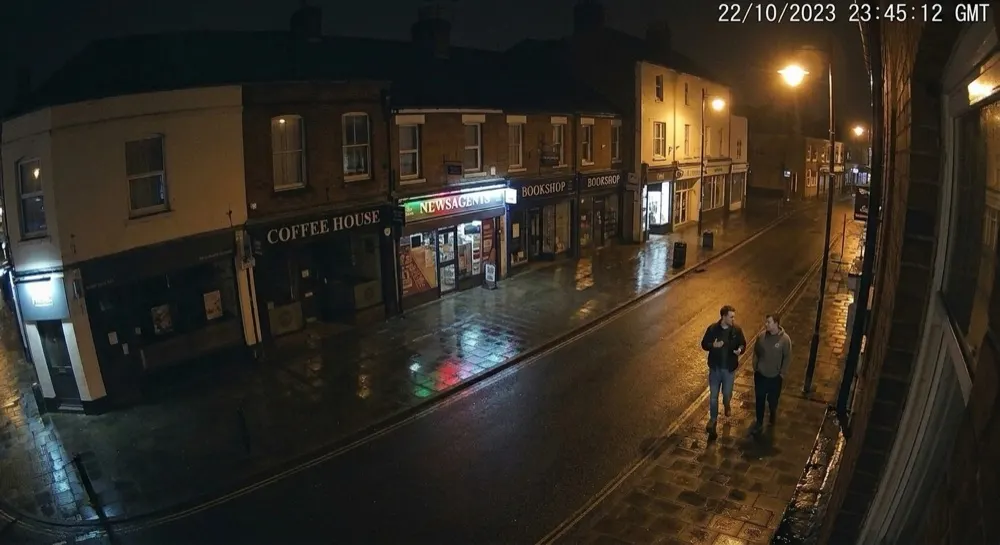 Fighting: Camera alert cleared by generative AI. People escalated for analysis; Gen AI clears it — pedestrians walking normally.