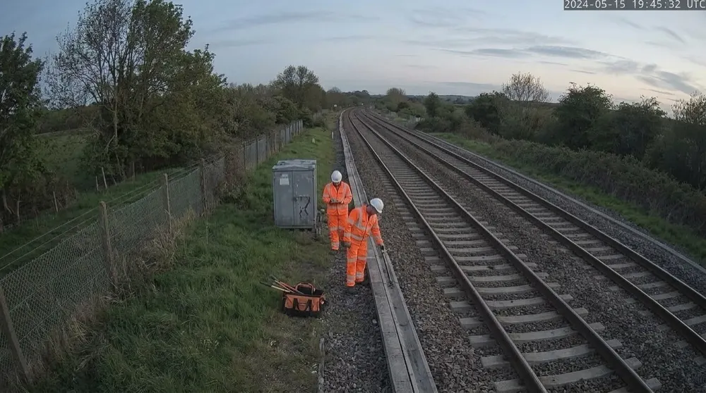 Rail cable theft: Camera alert cleared by generative AI. People escalated for analysis; Gen AI clears it — hi-vis maintenance crew on an inspection.